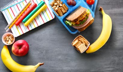 School,lunch,and,stationery,on,table
